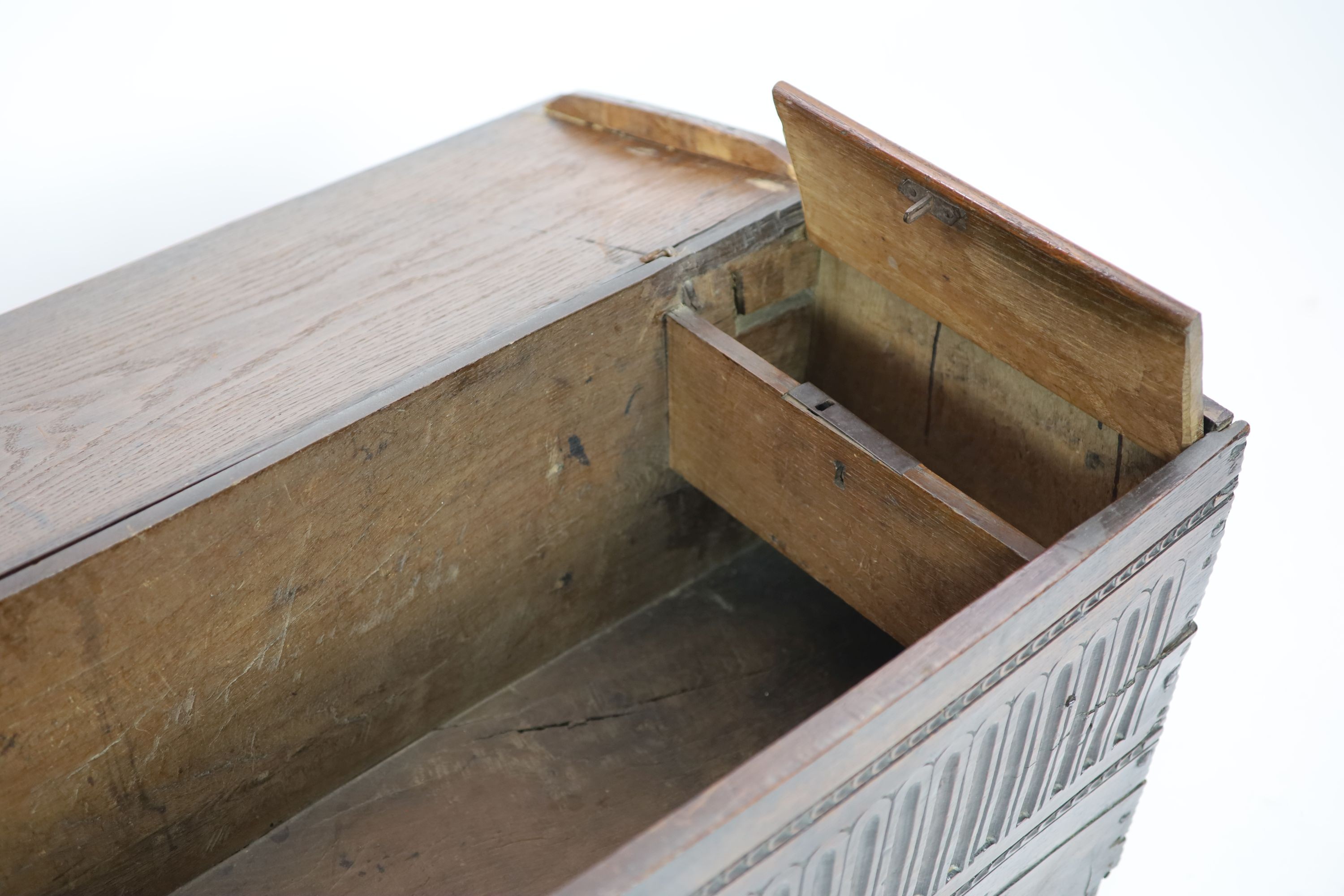 A 17th century oak six-plank chest H 64cm. W 124cm. D 38cm.
